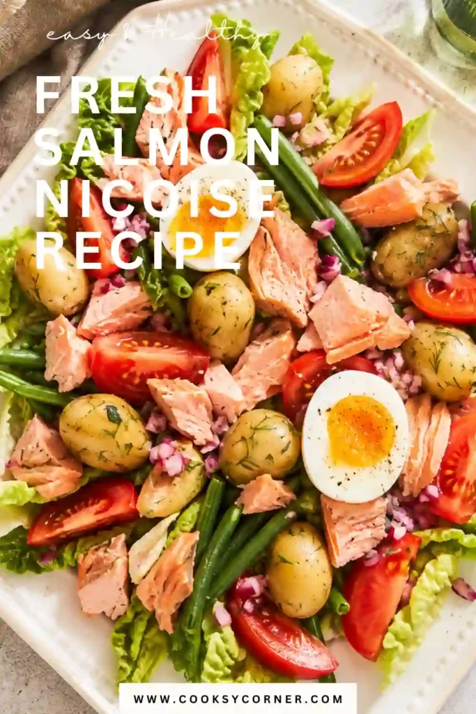 Fresh Salmon Niçoise Recipe served with wild salmon, baby potatoes, green beans, tomatoes, olives, lettuce, and hard-boiled eggs. This colorful French-inspired salmon salad looks fresh, vibrant, and healthy.