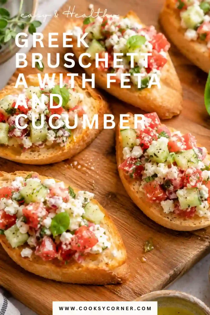 Tomato cucumber bruschetta featuring colorful diced vegetables and crumbled feta on toasted baguette. Olive oil, lemon, oregano, dill, and basil season the fresh topping.