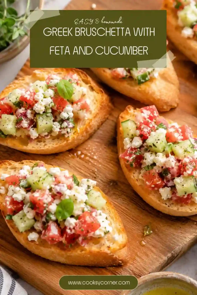 Mediterranean bruschetta with fresh tomato, cucumber, creamy feta, herbs, and lemon dressing on crispy crostini. The appetizer is garnished with additional herbs and feta.
