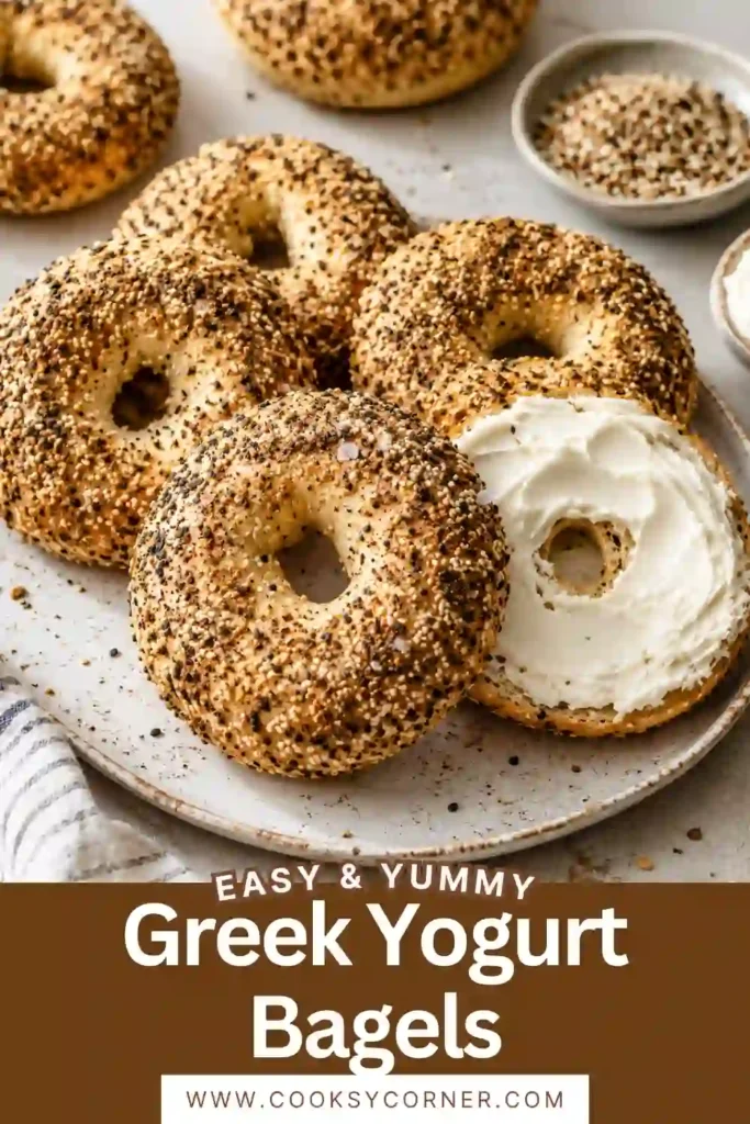 Golden brown homemade Greek Yogurt Bagels cooling on a wire rack after baking. Finished with savory everything bagel seasoning.