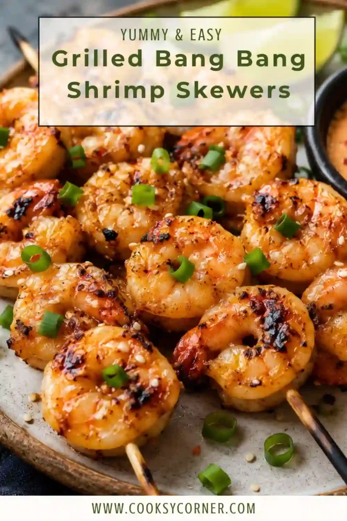 Grilled Bang Bang Shrimp Skewers arranged on a serving platter with extra creamy bang bang sauce for dipping. The shrimp are lightly charred from the grill and finished with fresh scallions.