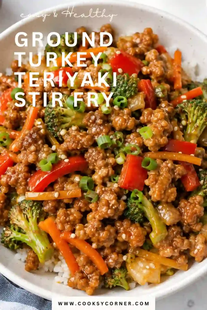 Healthy turkey stir fry made with ground turkey, fresh broccoli, shredded carrots, and homemade teriyaki sauce. The finished skillet meal has a rich, glossy sauce with garlic and ginger flavors.
