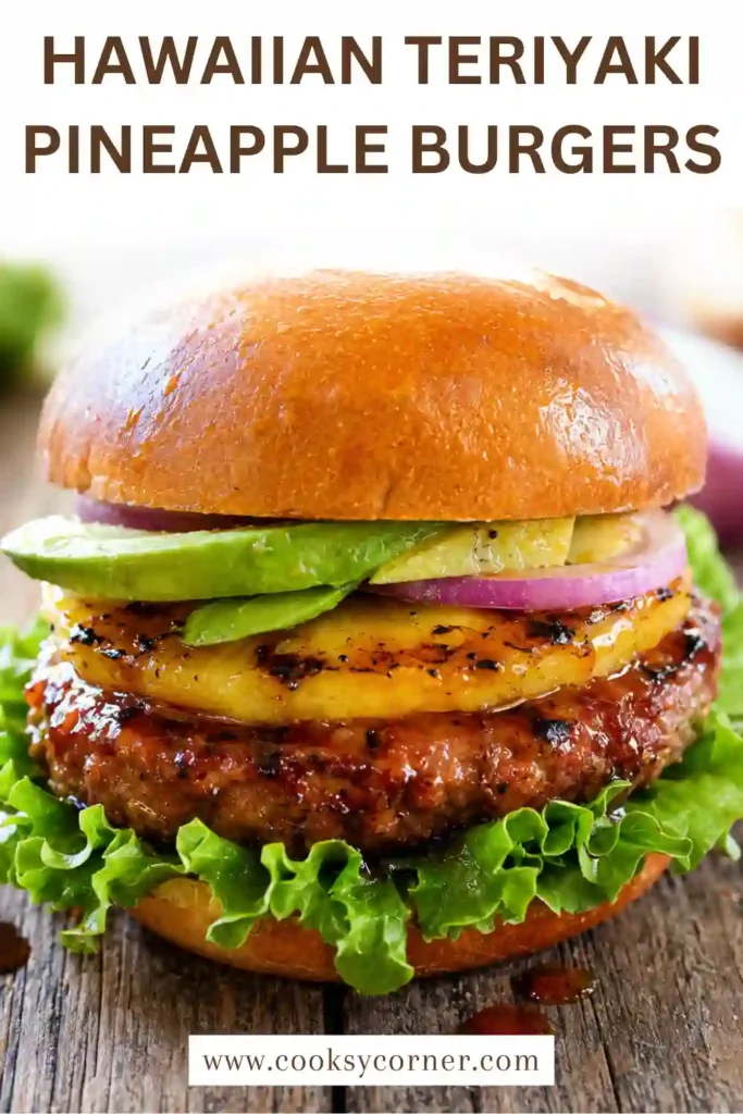 Grilled pineapple burger featuring a browned beef patty, golden pineapple ring, fresh lettuce, sliced tomato, and teriyaki glaze. The burger is served on a lightly toasted brioche-style bun.