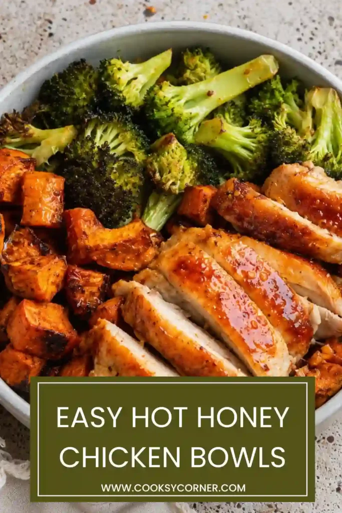 Chicken sweet potato bowl featuring sliced seasoned chicken, crispy roasted potatoes, broccoli, and savory turkey bacon. Hot honey and red pepper flakes add sweet and spicy flavor.