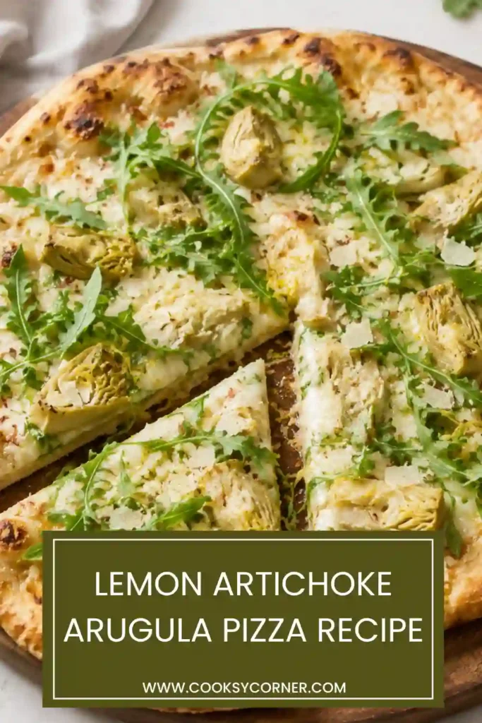 Freshly baked artichoke arugula pizza with a crisp golden crust, mozzarella cheese, lemon zest, garlic, and artichoke hearts. Peppery arugula and Parmesan cover the warm pizza.