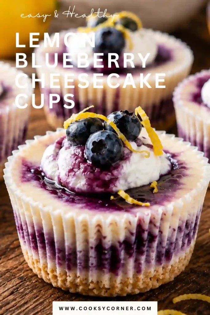 Lemon Blueberry Cheesecake Cups topped with homemade blueberry sauce, fresh blueberries, and whipped cream. The individual cheesecakes have a creamy lemon filling and Golden Oreo cookie base.