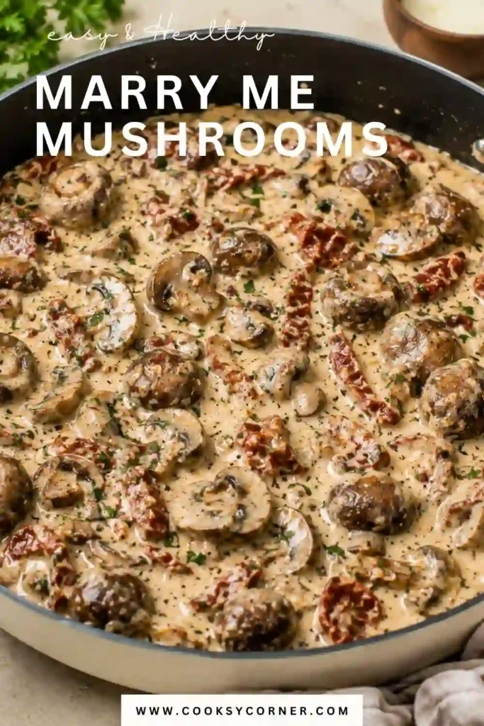 A skillet of Marry Me Mushrooms simmered in creamy garlic sauce with Parmesan cheese and sun-dried tomatoes. Fresh basil and red pepper flakes add color and Italian-inspired flavor.