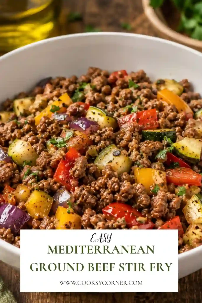 Mediterranean Ground Beef Stir-Fry with browned ground beef, zucchini, bell peppers, cherry tomatoes, and onions. Fresh herbs and lemon add bright Mediterranean flavor to the colorful skillet dinner.