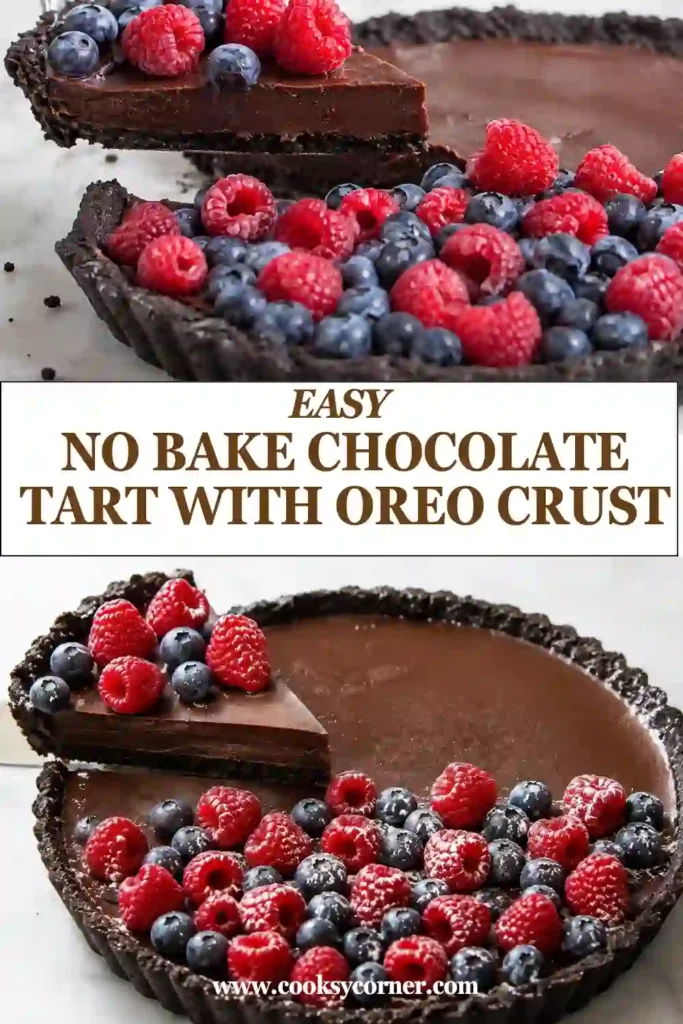 No-bake chocolate ganache tart with a crunchy Oreo crust, fresh raspberries, blueberries, and sliced strawberries. Powdered sugar lightly covers the colorful berry topping.