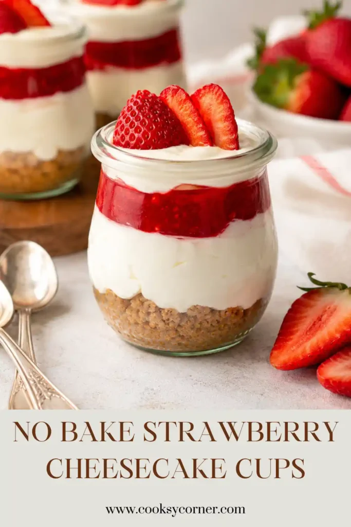 Mini Strawberry Cheesecake Cups served in clear dessert glasses with fresh strawberries and whipped cream. Each cup features beautiful layered textures.