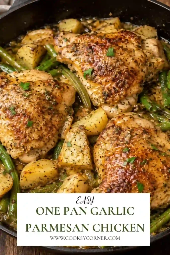 Golden roasted chicken thighs topped with garlic Parmesan sauce and served with roasted potatoes and green beans in a white baking dish.