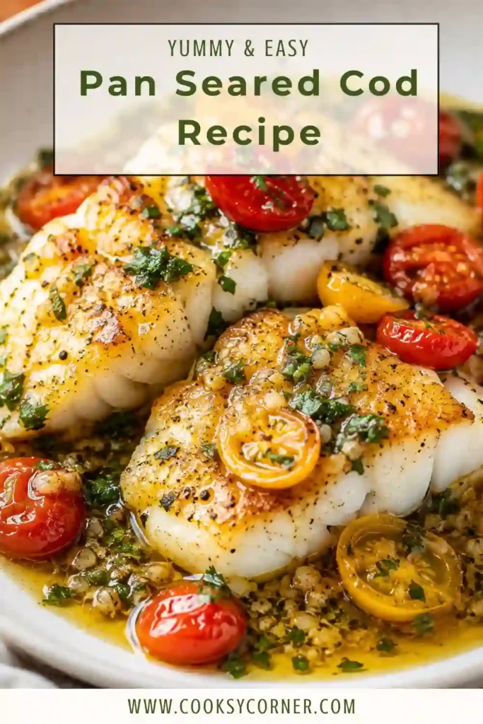 Tomato basil cod served in a skillet with fresh cherry tomatoes, basil, garlic, and lemon sauce. The tender pan-seared cod has a lightly golden exterior and flaky center.