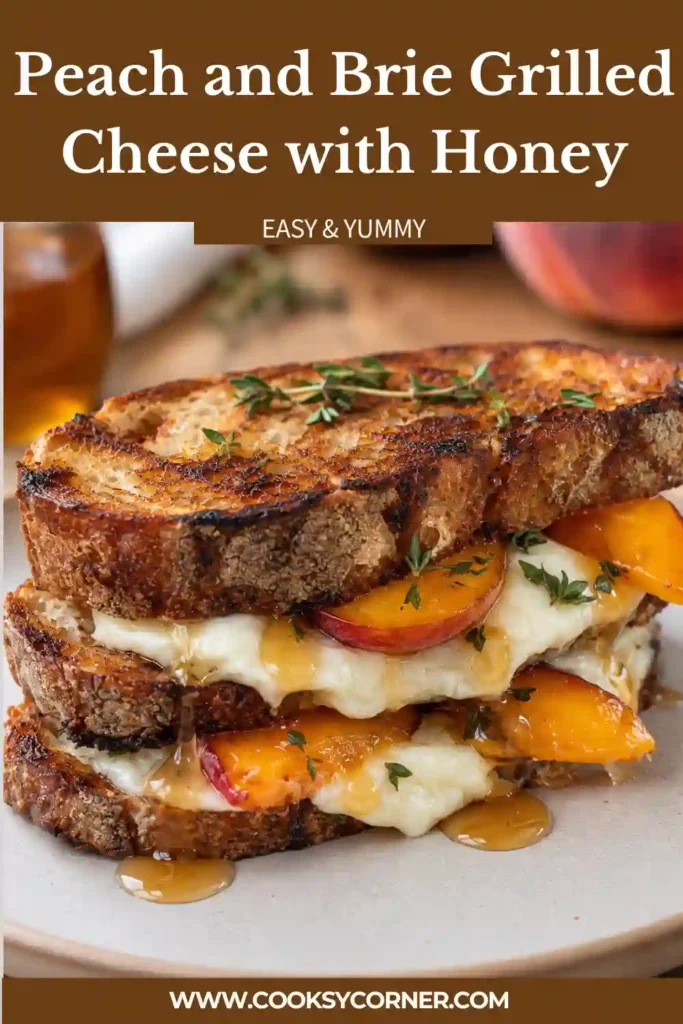 Peach and Brie sandwich with thick-cut golden sourdough, gooey cheese, seared peaches, and fresh thyme. A light honey drizzle adds a glossy finish to this summer grilled cheese.