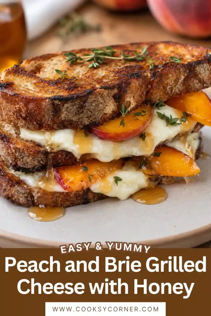 Peach and Brie Grilled Cheese with Honey made with golden sourdough, melted Brie, and caramelized fresh peach slices. Fresh thyme and a glossy honey drizzle finish the sweet and savory sandwich.