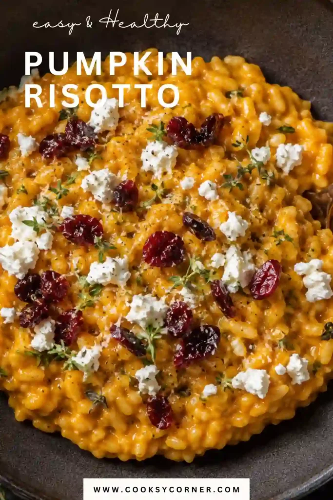 Homemade Pumpkin Risotto topped with creamy goat cheese, dried cranberries, fresh herbs, and black pepper. This easy pumpkin risotto has a rich golden-orange color and creamy texture.