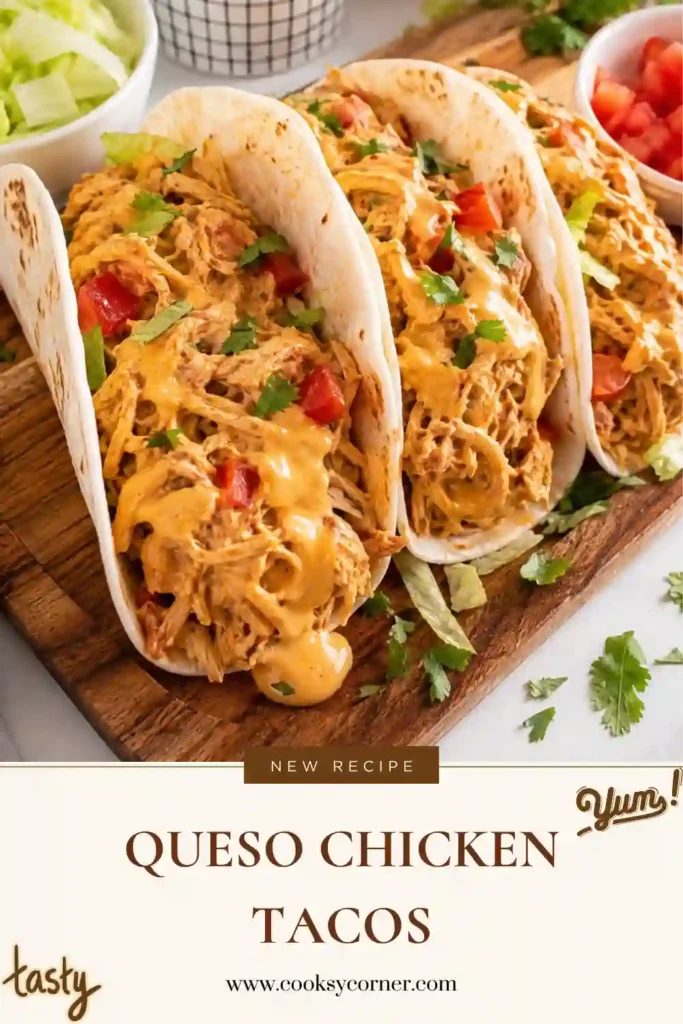 Queso Chicken Tacos filled with tender shredded chicken coated in creamy salsa con queso. The tacos are served in soft flour tortillas with fresh lettuce, tomatoes, cilantro, and sour cream.