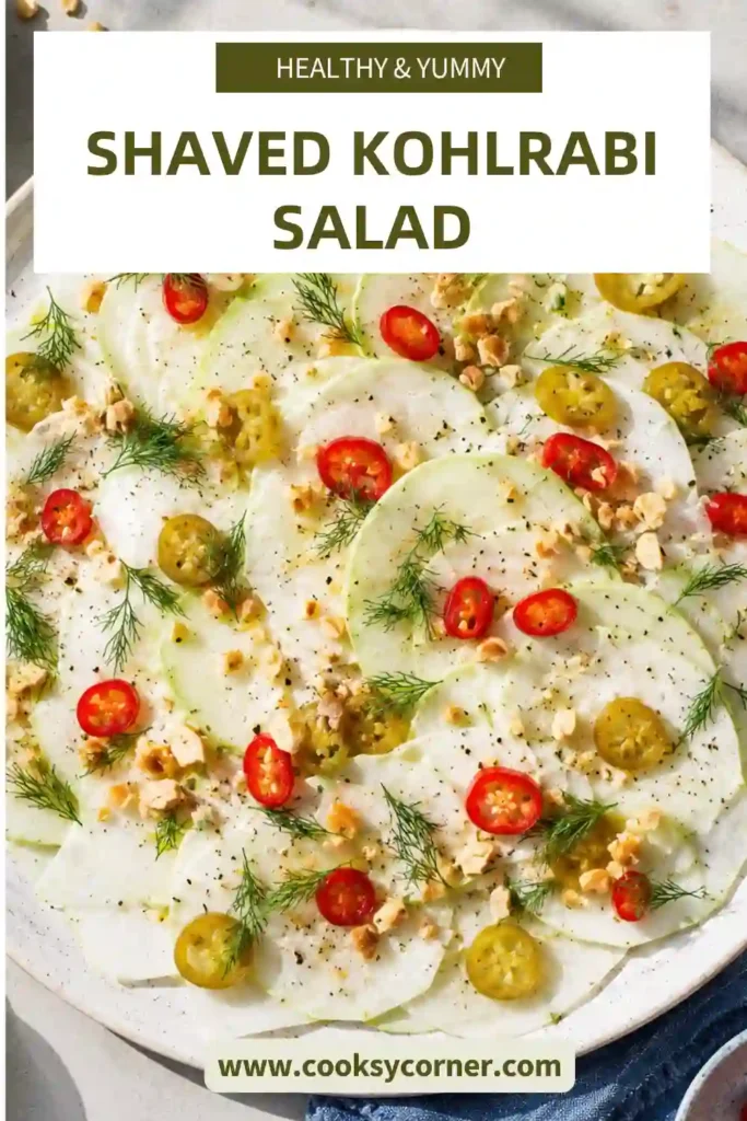 A fresh Shaved Kohlrabi Salad topped with creamy yogurt dressing, sliced pickled jalapeños, fresh dill, red chili, and crushed peanuts. The salad looks crisp, colorful, and perfect for a healthy meal.