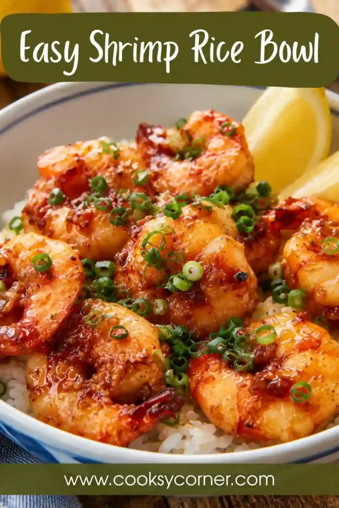 Garlic butter Shrimp Rice Bowl with fluffy white rice, tender shrimp, chopped scallions, and fresh lemon wedges. A quick and flavorful seafood dinner.