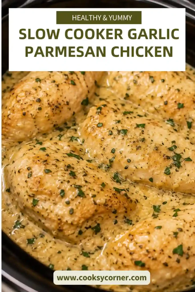 Creamy Slow Cooker Garlic Parmesan Chicken topped with grated Parmesan and chopped parsley. Tender chicken and a velvety garlic cream sauce create a comforting family dinner.