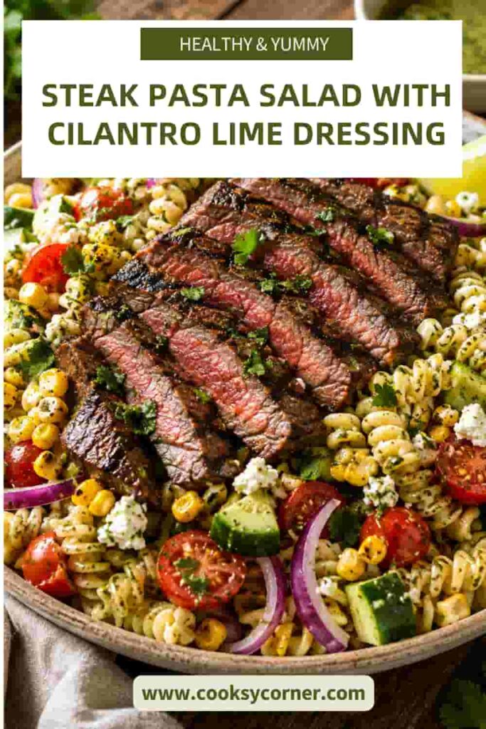 Grilled steak pasta salad featuring tender ribeye, fusilli, charred vegetables, cherry tomatoes, cucumber, cilantro, and cheese. The salad is finished with a fresh lime vinaigrette.