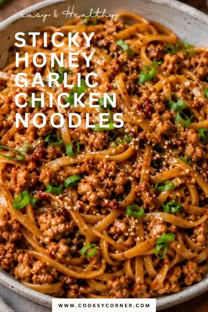 2. A bowl of honey garlic chicken noodles with chewy noodles, caramelized ground chicken, cabbage, carrots, and green onions. A sticky sweet and spicy sauce coats every bite.