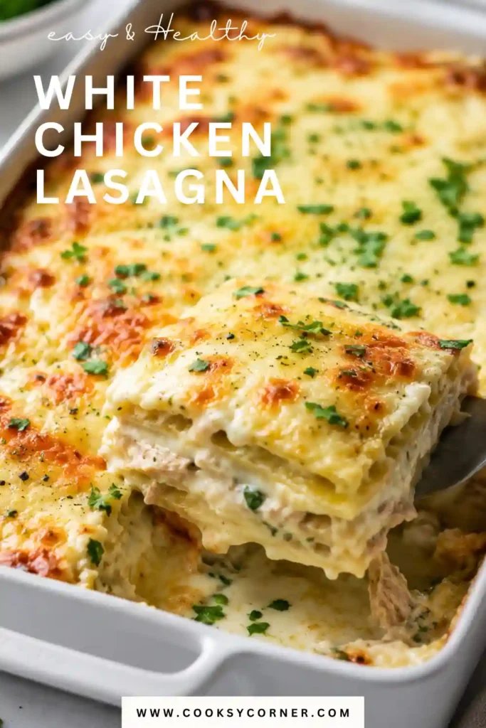 Creamy White Chicken Lasagna served in thick layers of tender pasta, chicken, spinach cream sauce, and cheese. Melted mozzarella covers the top with lightly browned edges.