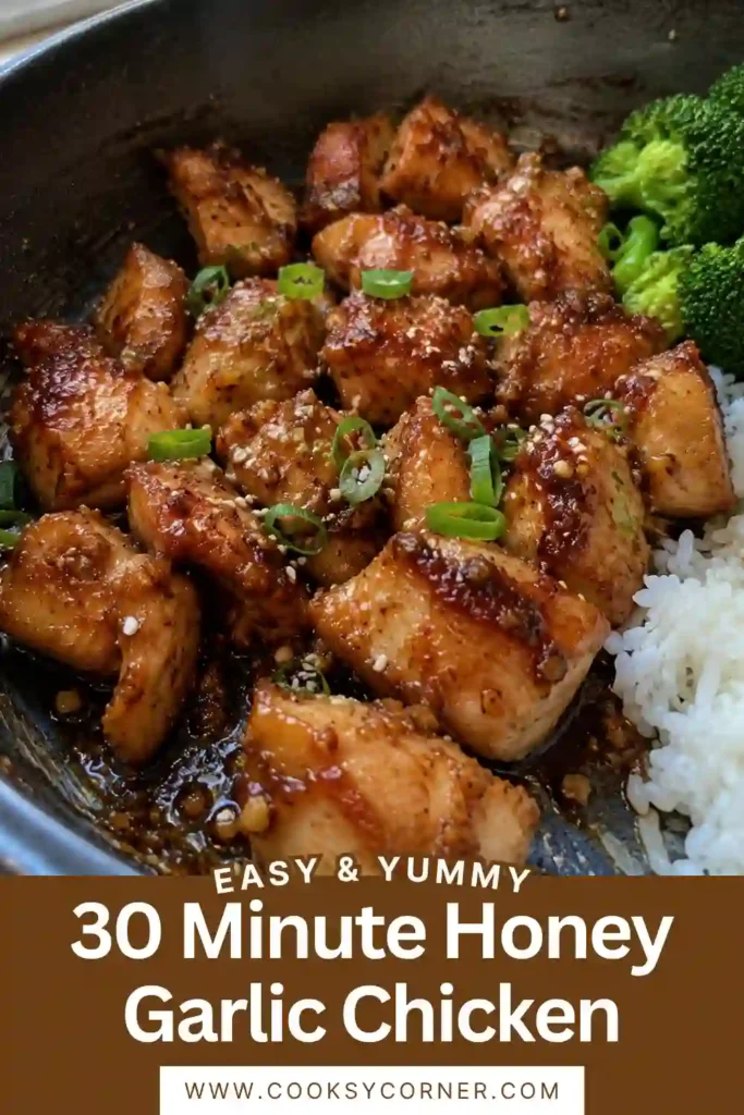 Easy honey garlic chicken featuring tender chicken bites covered in a glossy honey, garlic, soy, sesame, and gochujang sauce. Bright green broccoli provides a fresh contrast to the caramelized chicken.