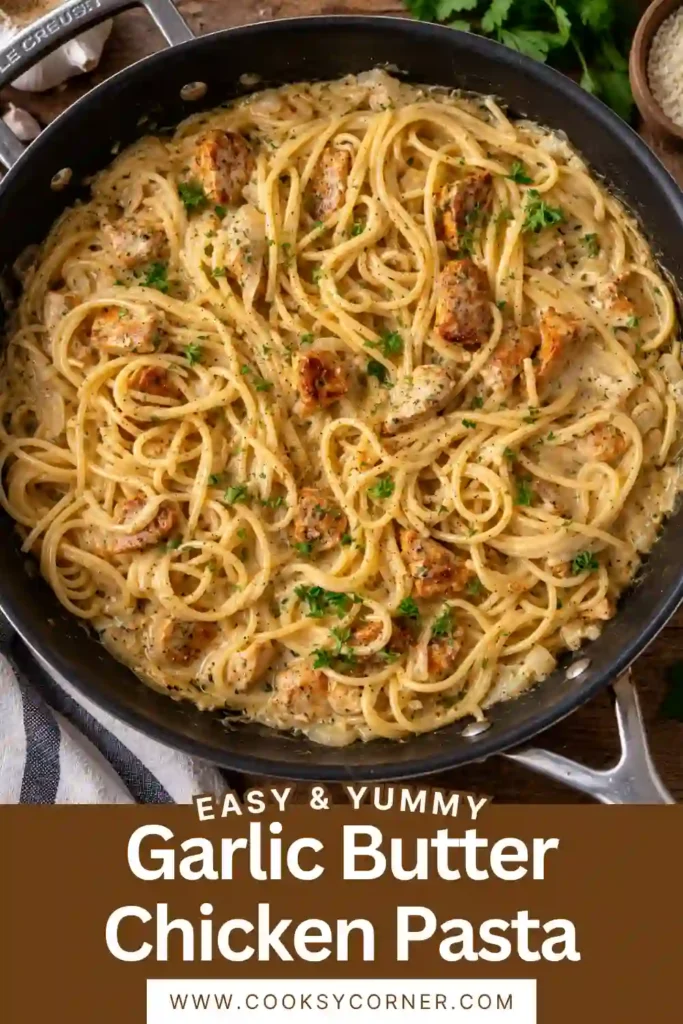 Creamy garlic chicken pasta with tender seasoned chicken, spaghetti, and a rich garlic butter sauce. The pasta is topped with Parmesan-style cheese, chopped parsley, and freshly ground black pepper.