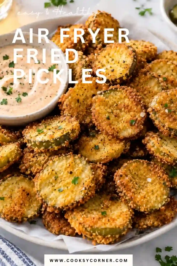 Air Fryer Fried Pickles with a golden panko breadcrumb coating served beside creamy remoulade sauce. The crispy pickle chips reveal tangy dill pickle centers beneath the crunchy breading.