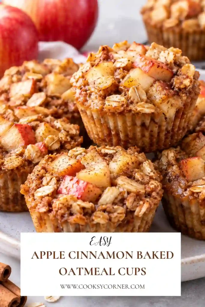Freshly baked apple oatmeal cups with visible rolled oats and chunks of tender apple. These make-ahead breakfast cups are naturally sweetened with maple syrup and warmly flavored with cinnamon.