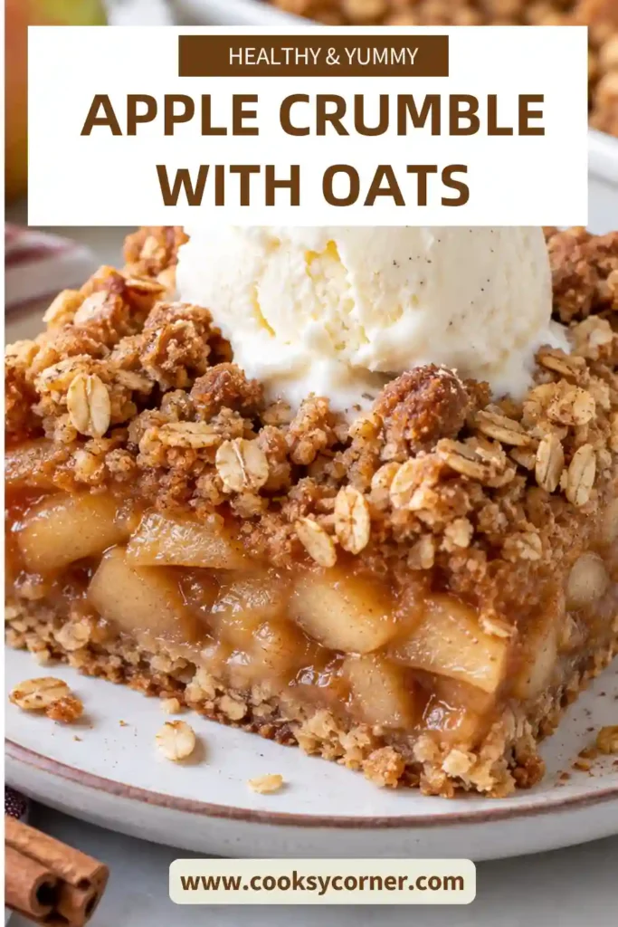 Easy apple crumble with oats featuring tender baked apples, cinnamon, brown sugar, and a crunchy golden topping. Vanilla ice cream melts over the warm fruit dessert.