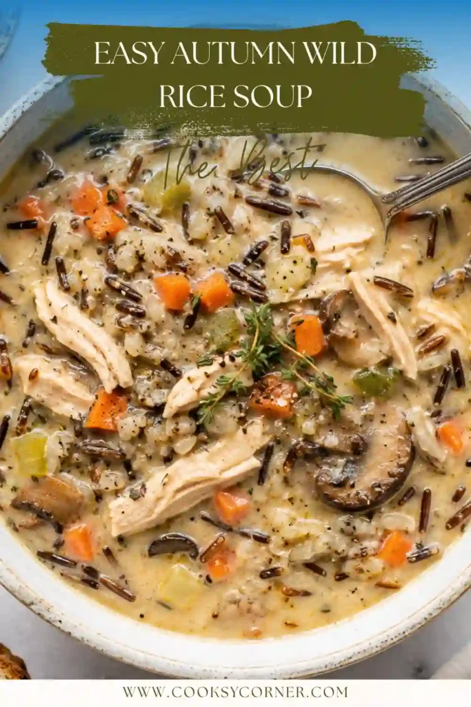 A warm bowl of Autumn Wild Rice Soup filled with mushrooms, sweet potato, kale, and tender wild rice. Creamy coconut milk gives the vegetable soup a rich and comforting texture.