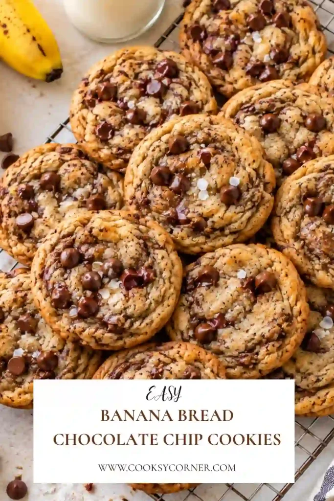 Banana Bread Chocolate Chip Cookies stacked on a rustic plate with golden edges and soft centers. Melted chocolate chunks, banana flavor, and flaky sea salt give the cookies a bakery-style finis