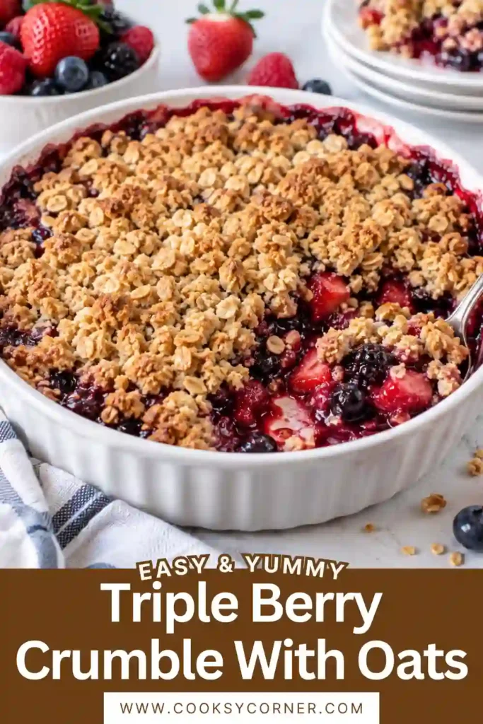 Homemade mixed berry crumble with juicy berries and a golden cinnamon oat topping served warm in a baking dish. This easy berry crumble can be made with fresh or frozen berries.