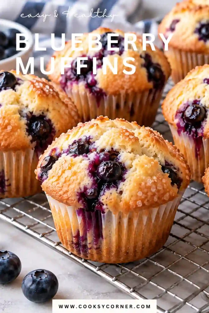 Blueberry Muffins (Ultra Moist!) with tall golden tops and fresh blueberries baked throughout. The homemade blueberry muffins have soft, fluffy centers and juicy berries in every bite.
