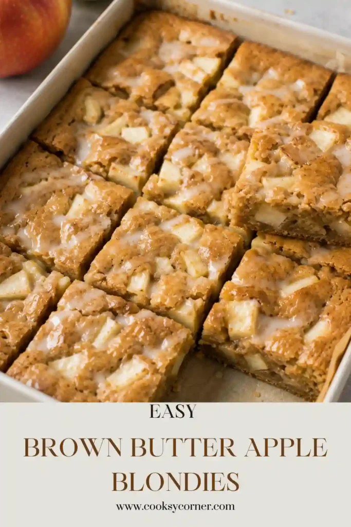 Brown Butter Apple Blondies sliced into soft, chewy squares and topped with creamy brown butter icing. Tender cinnamon apples add warm fall flavor throughout the homemade blondies.