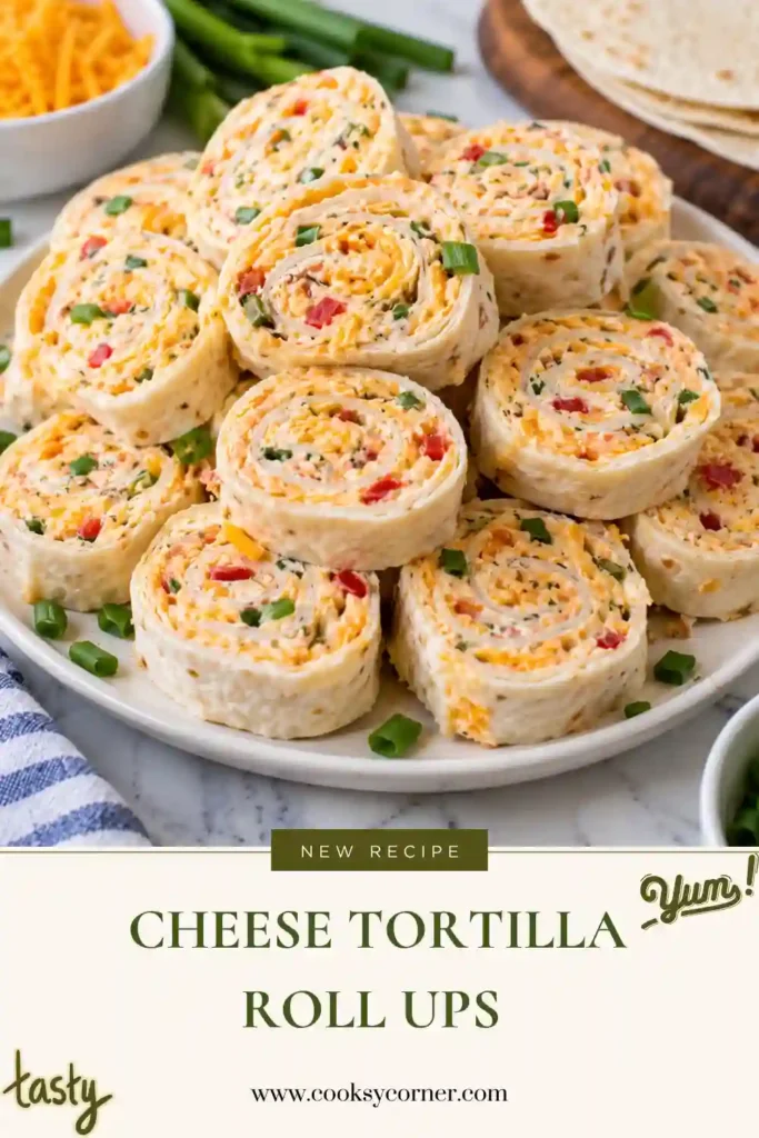 Cheese Tortilla Roll Ups filled with cream cheese, cheddar, turkey ham, ranch seasoning, and green onions. The chilled tortillas are sliced into colorful bite-sized pinwheels.