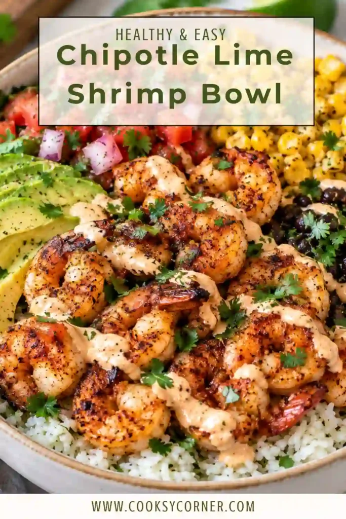 Fresh Chipotle Lime Shrimp Bowl topped with spicy shrimp, creamy avocado, tomatoes, cucumber, red onion, and cilantro. The bowl is finished with a zesty homemade chipotle lime dressing.