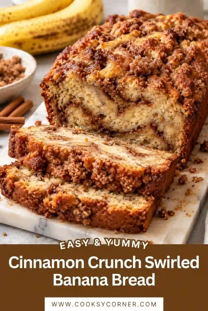 Homemade banana bread with cinnamon sugar swirl and buttery brown sugar crunch. The golden loaf has a moist center with visible cinnamon ribbons in every slice.