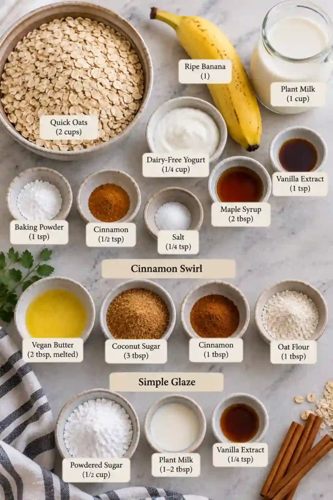 Easy cinnamon baked oatmeal with a buttery cinnamon sugar swirl and sweet vanilla glaze. The baked oats are cut into portions, revealing a tender texture and warm cinnamon filling.