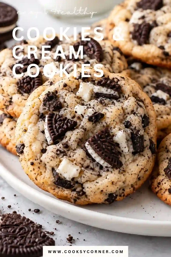 Soft cookies and cream cookies stacked with chunks of Oreos and white chocolate chips visible on top. Cream cheese gives these homemade cookies a rich and tender bakery-style texture.