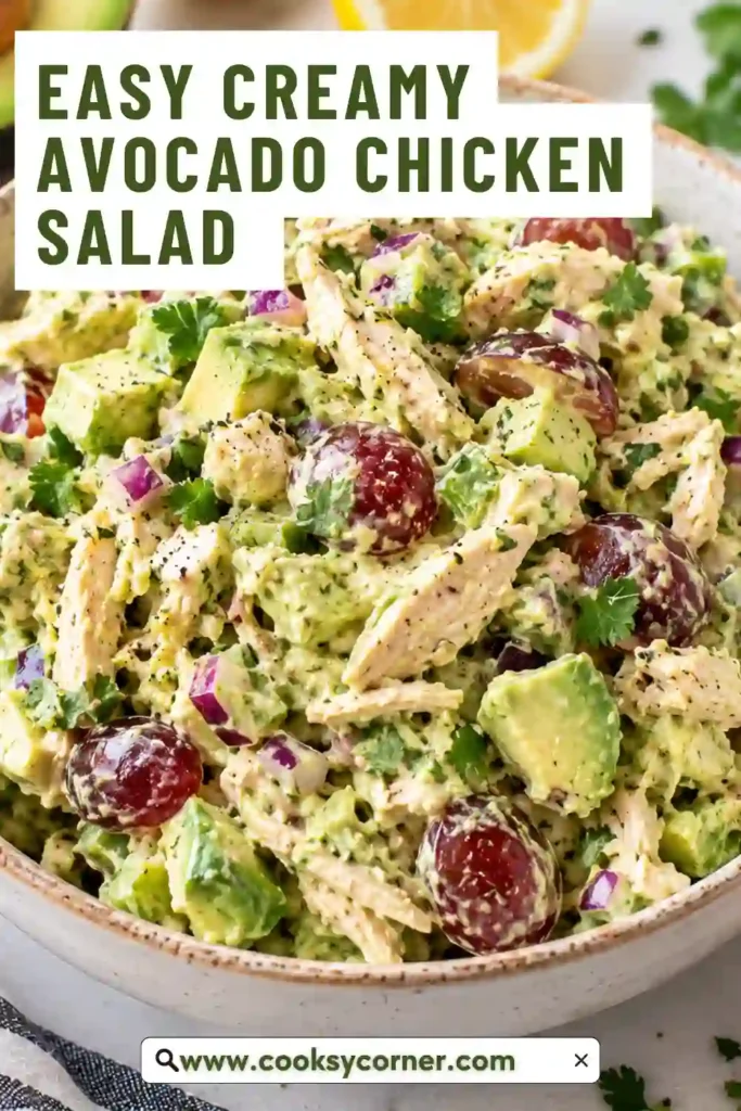 A bowl of creamy chicken avocado salad topped with fresh cilantro and avocado pieces. Tender shredded chicken is mixed with crunchy celery, onion, mayonnaise, and lime.