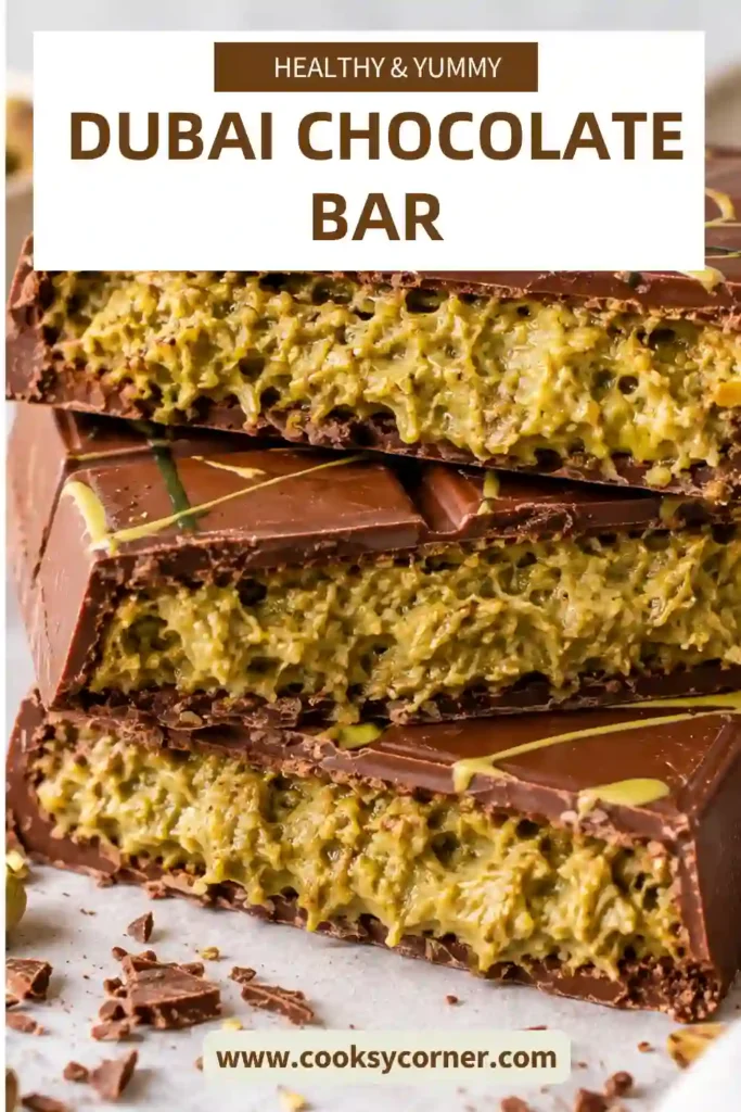Dubai Chocolate Bar filled with creamy pistachio, tahini, and crispy golden kataifi pastry inside a smooth milk chocolate shell. The sliced bar reveals a thick green pistachio filling with crunchy pastry strands.