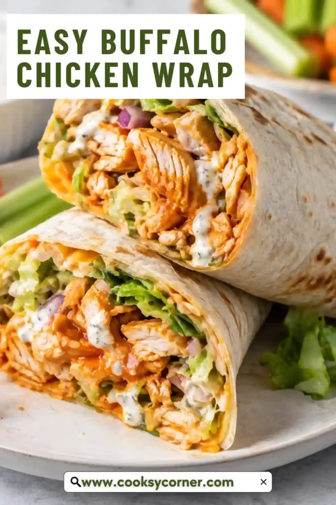Buffalo Chicken Wrap filled with spicy chicken, crisp romaine lettuce, shredded carrots, avocado, cheddar cheese, and creamy ranch dressing. The wrap is sliced in half to show the colorful filling.