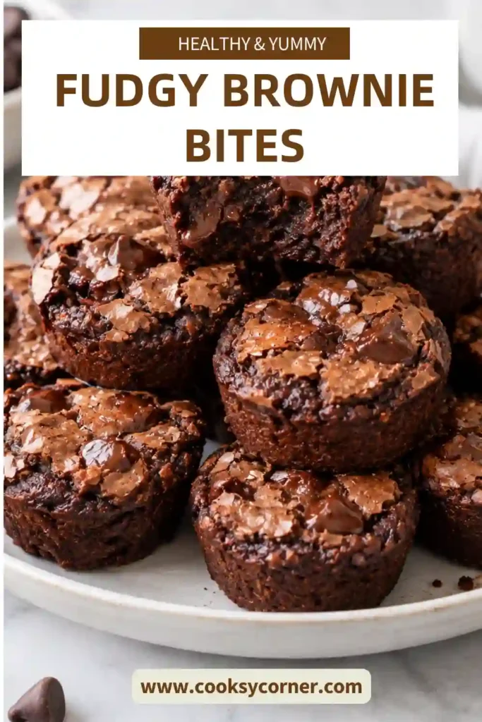 Fudgy Brownie Bites with rich chocolate centers and delicate brownie tops arranged on a serving plate. These mini brownie bites are baked in a mini muffin pan for an easy bite-size dessert.