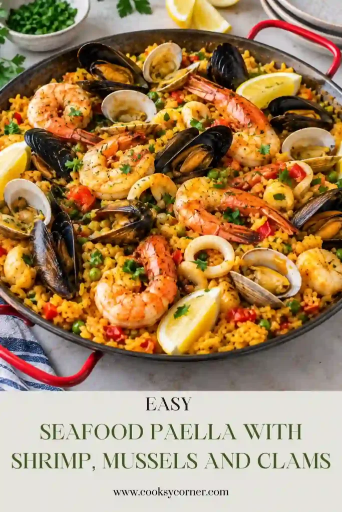 Close-up of mixed seafood paella with pink shrimp, opened mussels, clams, and seasoned Arborio rice. Smoked paprika and tomatoes give the rice a warm red-gold color.