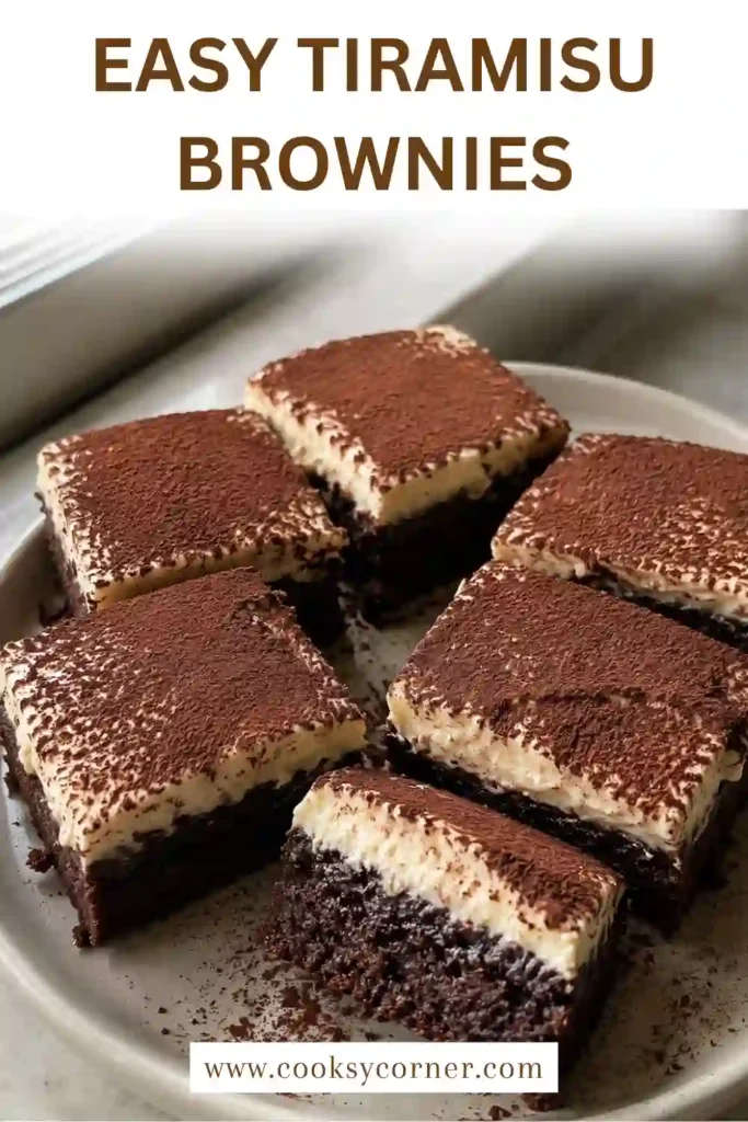 Coffee mascarpone brownies with dense chocolate centers and a thick layer of creamy tiramisu topping. Cocoa powder is dusted generously over the chilled dessert squares.