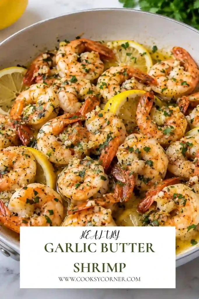 Garlic Butter Shrimp cooked in a skillet with melted butter, minced garlic, fresh lemon juice, and chopped parsley. The juicy shrimp are coated in a glossy lemon garlic butter sauce.