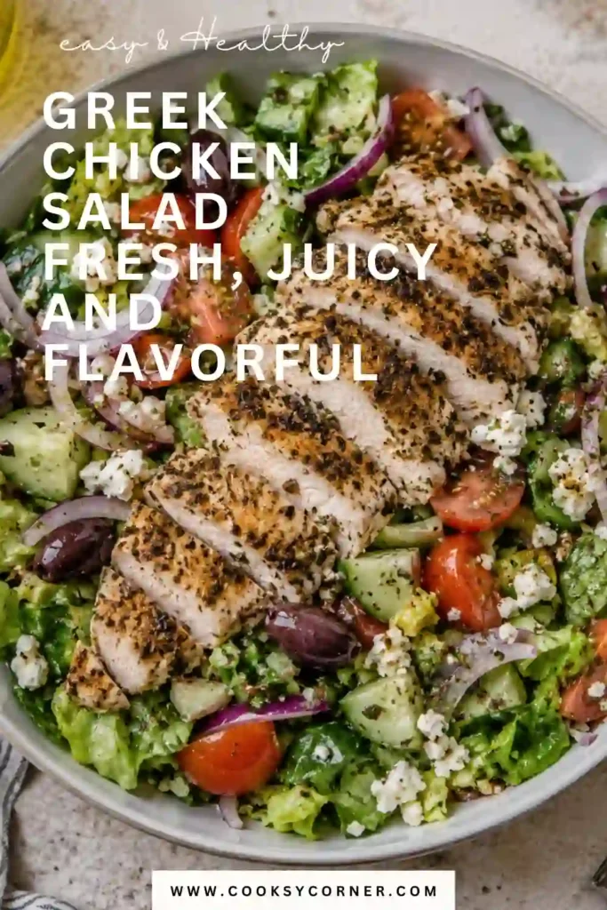 Greek Chicken Salad featuring tender Greek yogurt marinated chicken over crisp romaine with cucumber, tomatoes, Kalamata olives, and feta. Fresh vegetables and Greek dressing complete the salad.