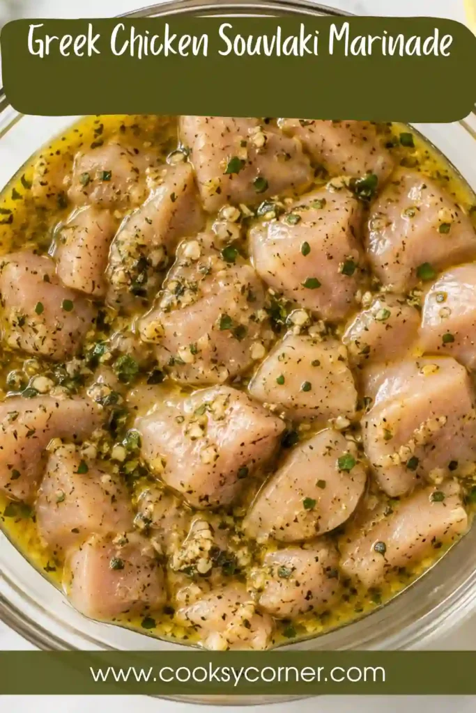 Grilled chicken skewers prepared with a lemon garlic chicken marinade and Mediterranean herbs. The golden chicken pieces are juicy, lightly charred, and seasoned with oregano.
